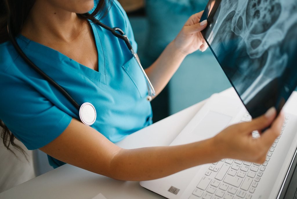 A physician going through a treatment plan with a patient